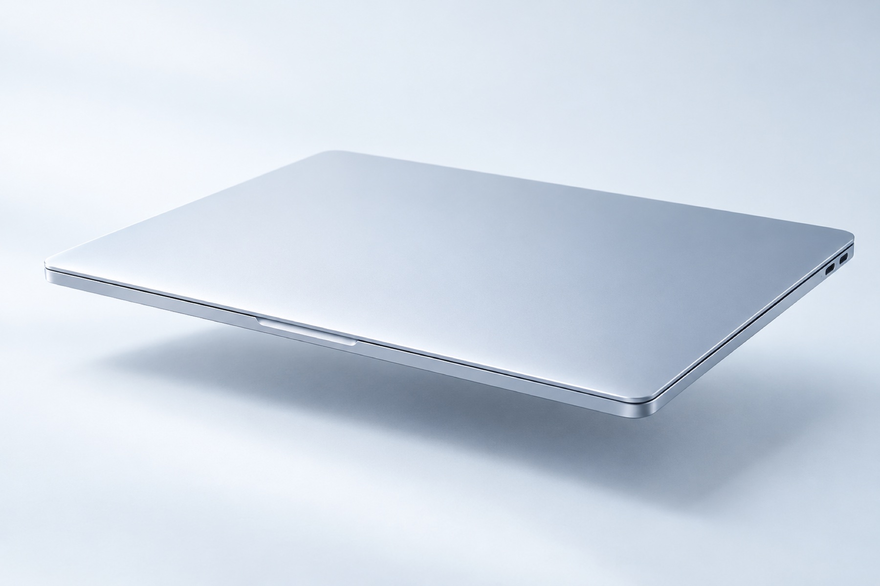 A closed silver laptop, shown as a product illustration